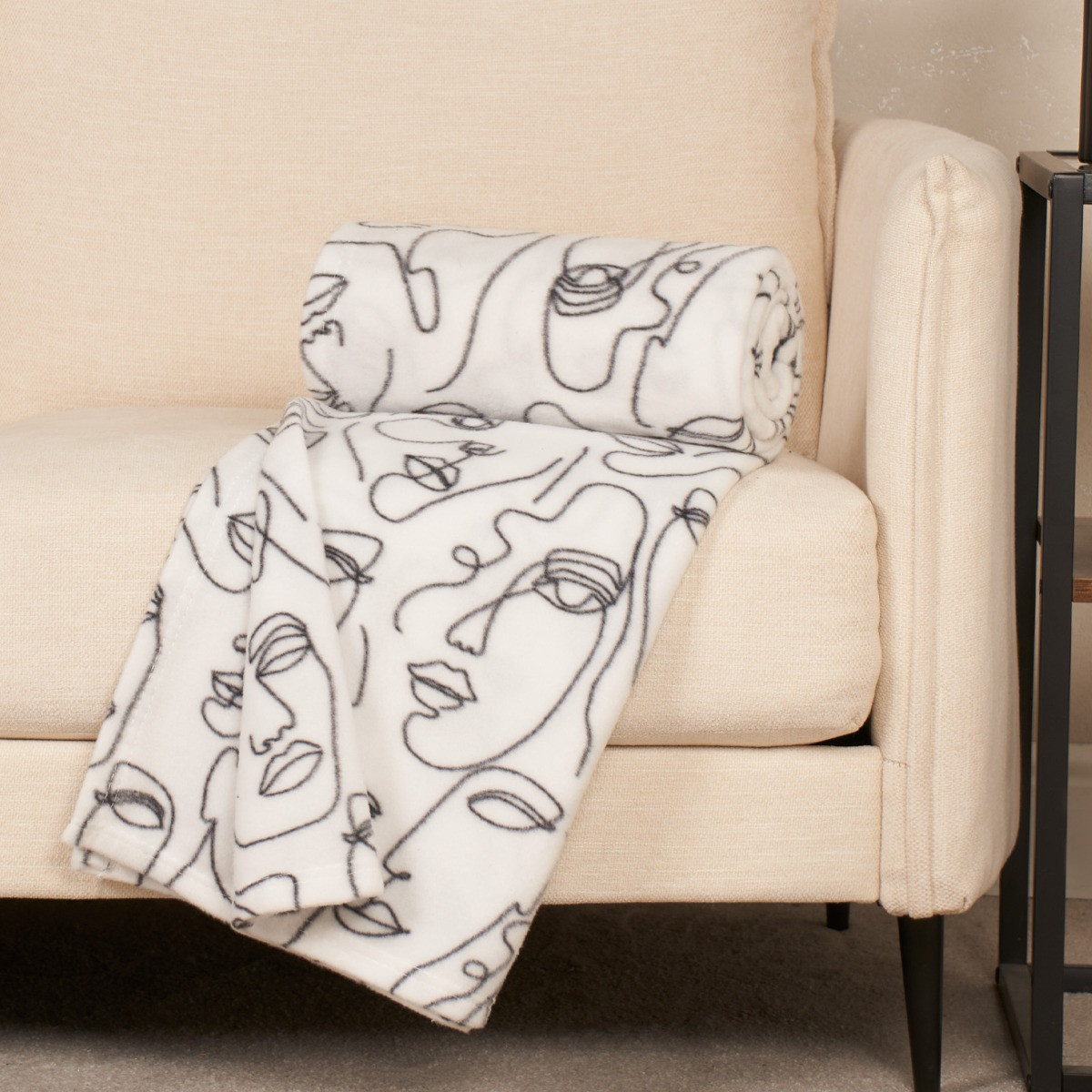 Abstract face reversible store throw blanket